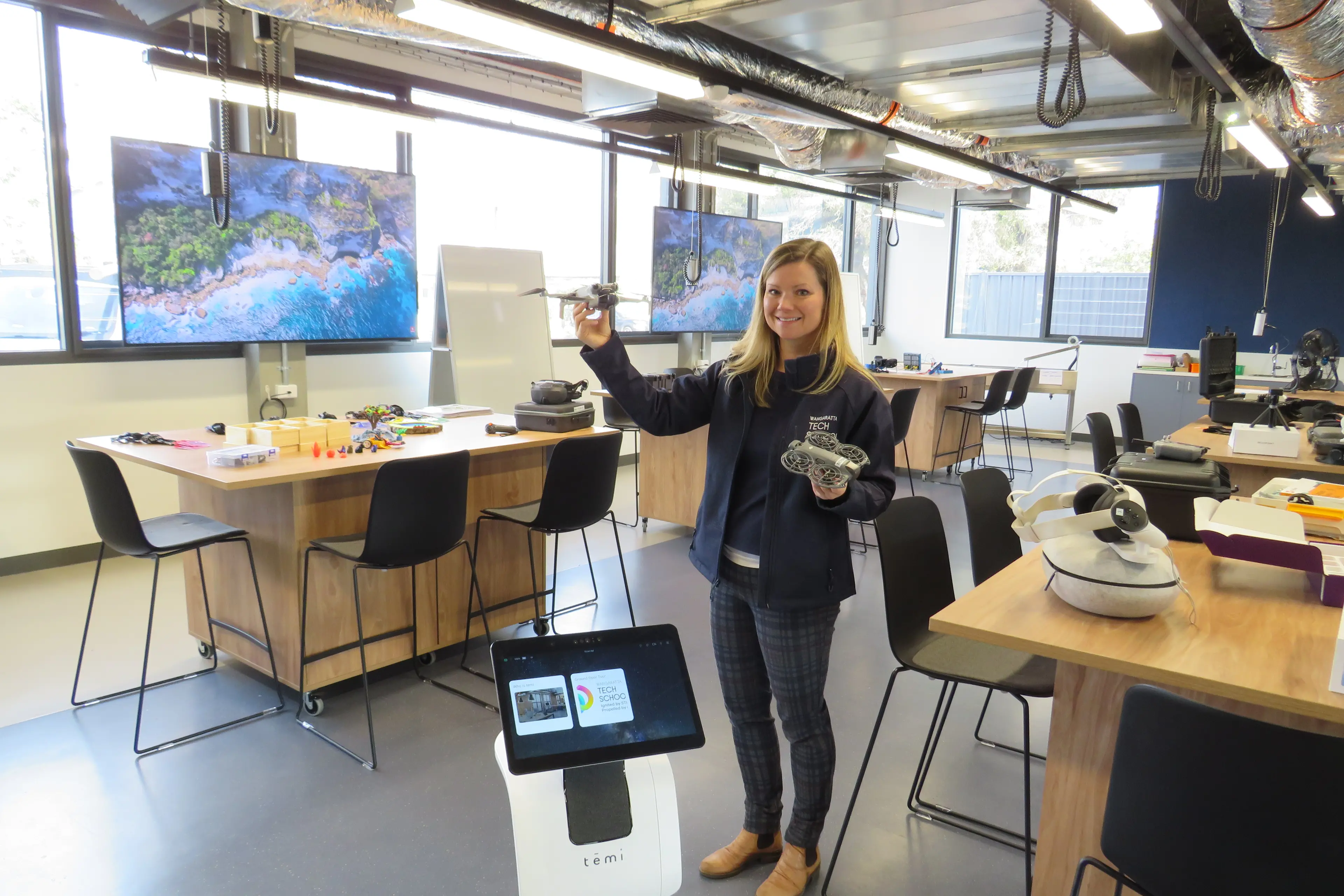 <p>HANDS-ON TECH: Wangaratta Tech School head of programs Lia Mitchell, and robot Temi (front), are ready to welcome students to the tech school this term. PHOTO: Simone Kerwin </p>\\n