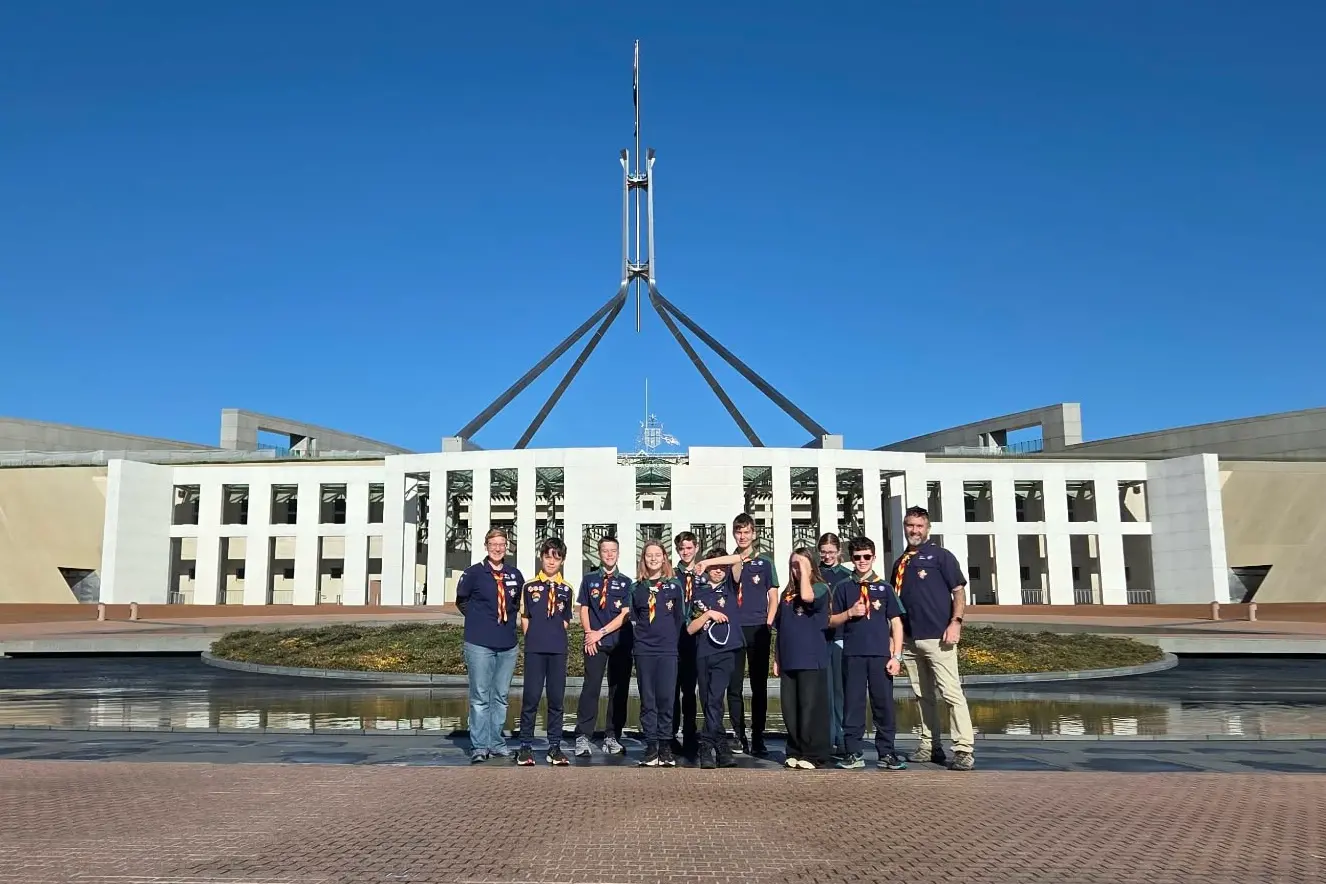 <p>CAPITAL VISIT: 1st Yarrunga Scout Group in the foreground of Parliament House in Canberra.</p>\\n