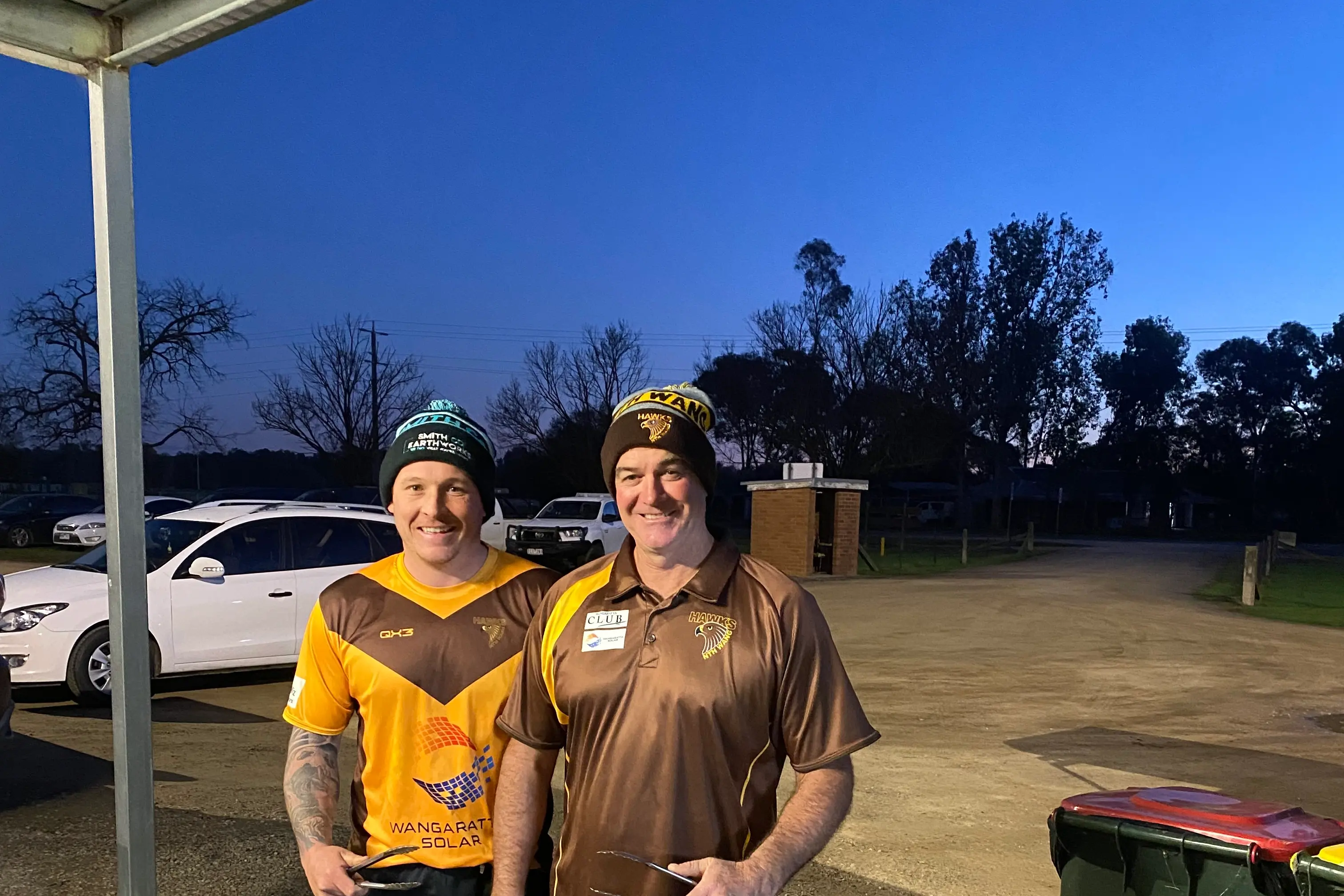 <p>LEGEND OF THE TONGS CANDIDATE: BBQ legend Shane Matheson (right) with North Wangaratta senior coach Corey Smith.</p>\\n