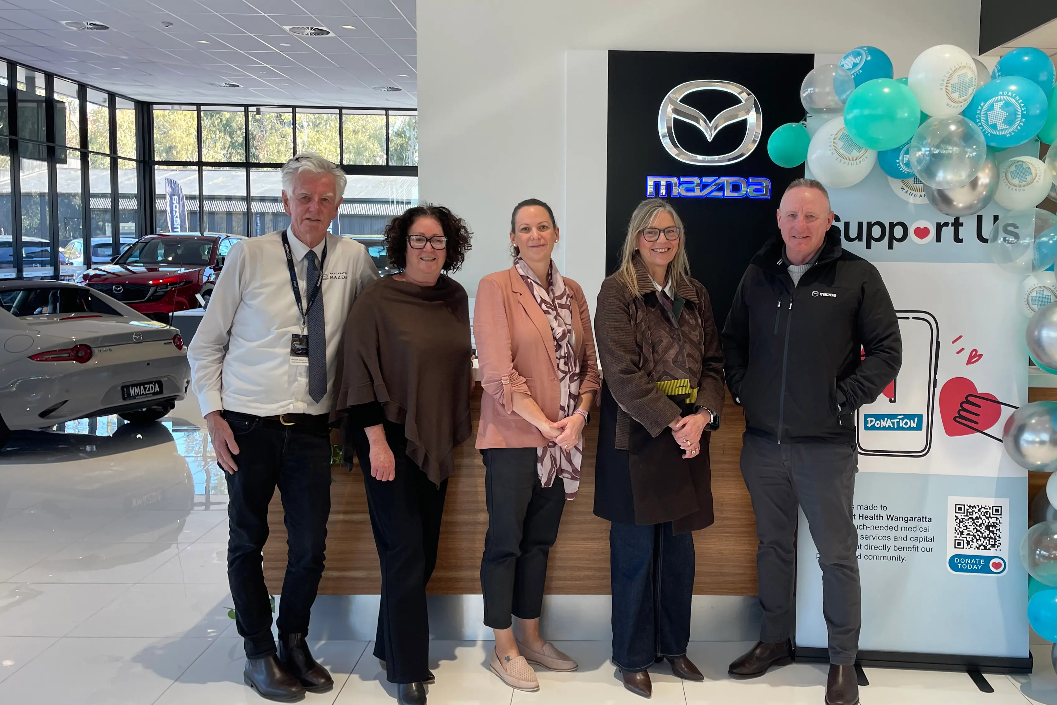<p>HEALTHY PARTNERSHIP: Wangaratta Mazda dealer principal Allan Rutherford (right) and sales representative Noel Gilbert, together with Northeast Health Wangaratta\\'s Kim Bennetts, Samantha Cooper and Libby Fifis, are delighted in the new partnership which is supporting the NHW Cancer and Wellness Centre.</p>\\n