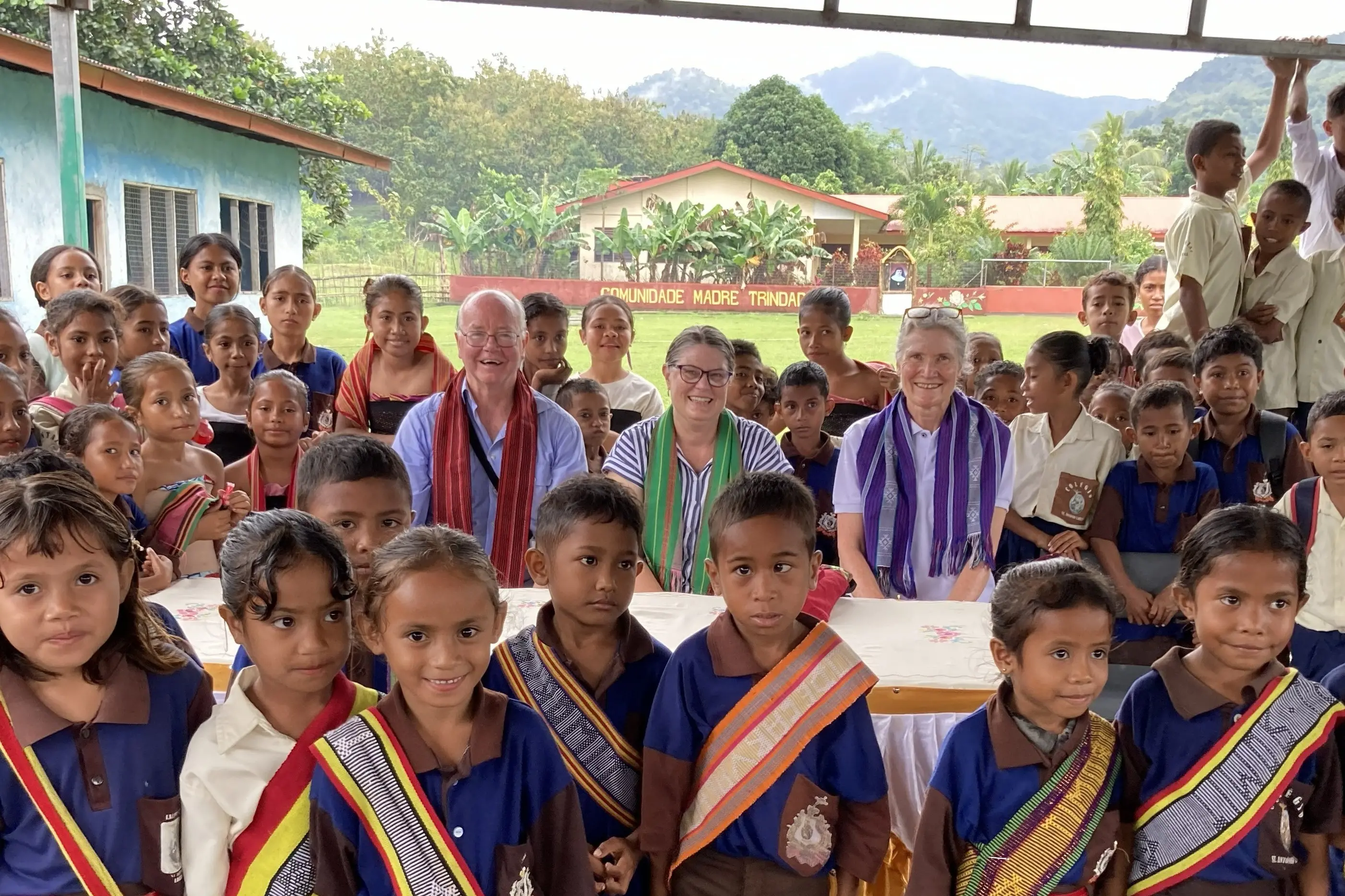 <p>PHILANTHROPIC WORK: Children at St Antonio school in Lacluta with (centre, from left); Brian Thompson, Karen Champlin and Karen Jones.</p>\\n