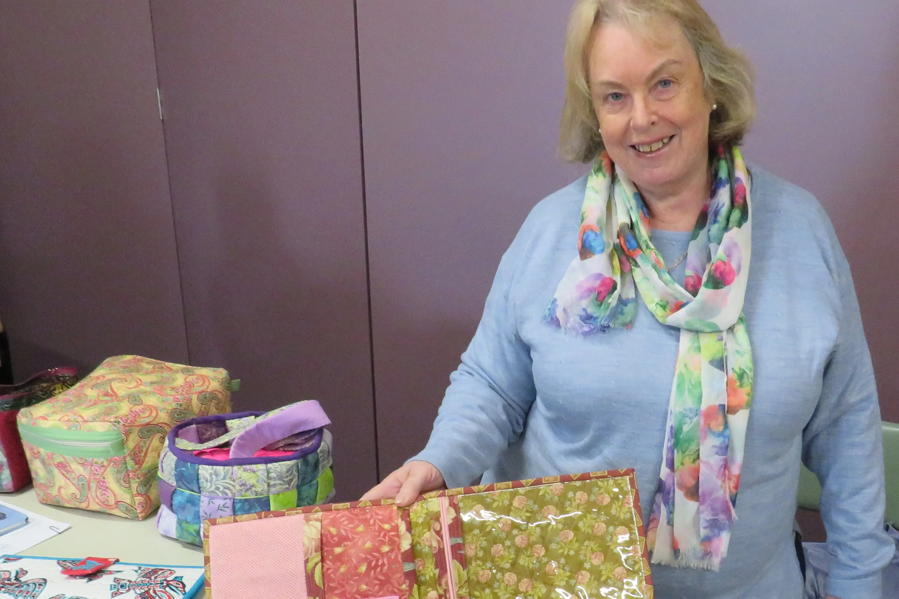 <p>COLOURFUL CREATIONS: Sue Matthews shows some of the work created by members of Dorcas Quilters Wangaratta, which holds meetings on the first Tuesday of each month at the Seventh-day Adventist Hall in Phillipson Street.  New members are always welcome.  PHOTO: Simone Kerwin</p>\\n
