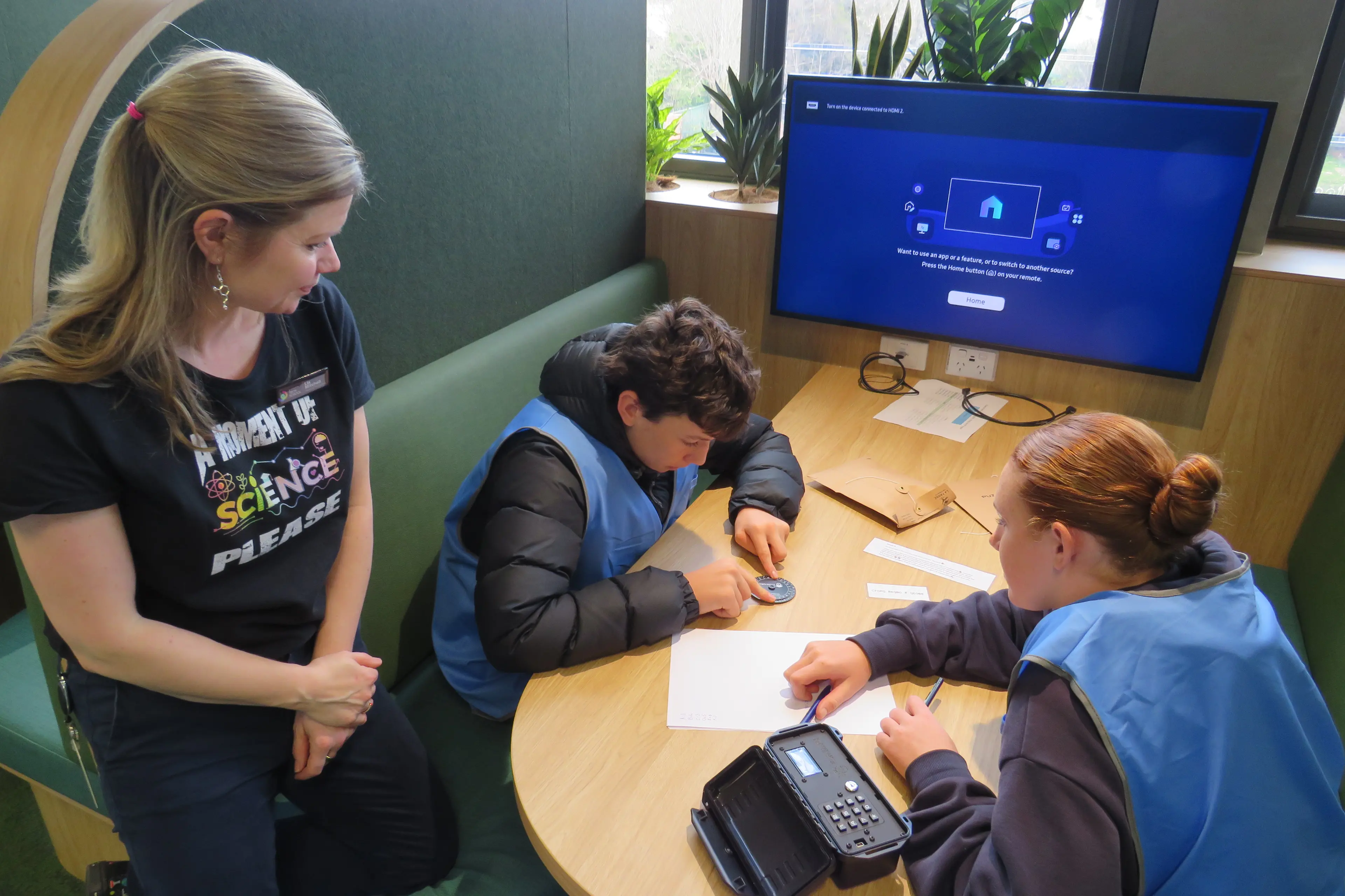 <p>PUZZLING IT OUT: Wangaratta Tech School head of programs Lia Mitchell watches Beechworth Secondary College\\'s Naisen James Hillier and Wangaratta High School\\'s Inanay Gilson work on one of the Science Slam activities, a cybersecurity escape room. PHOTO: Simone Kerwin </p>\\n