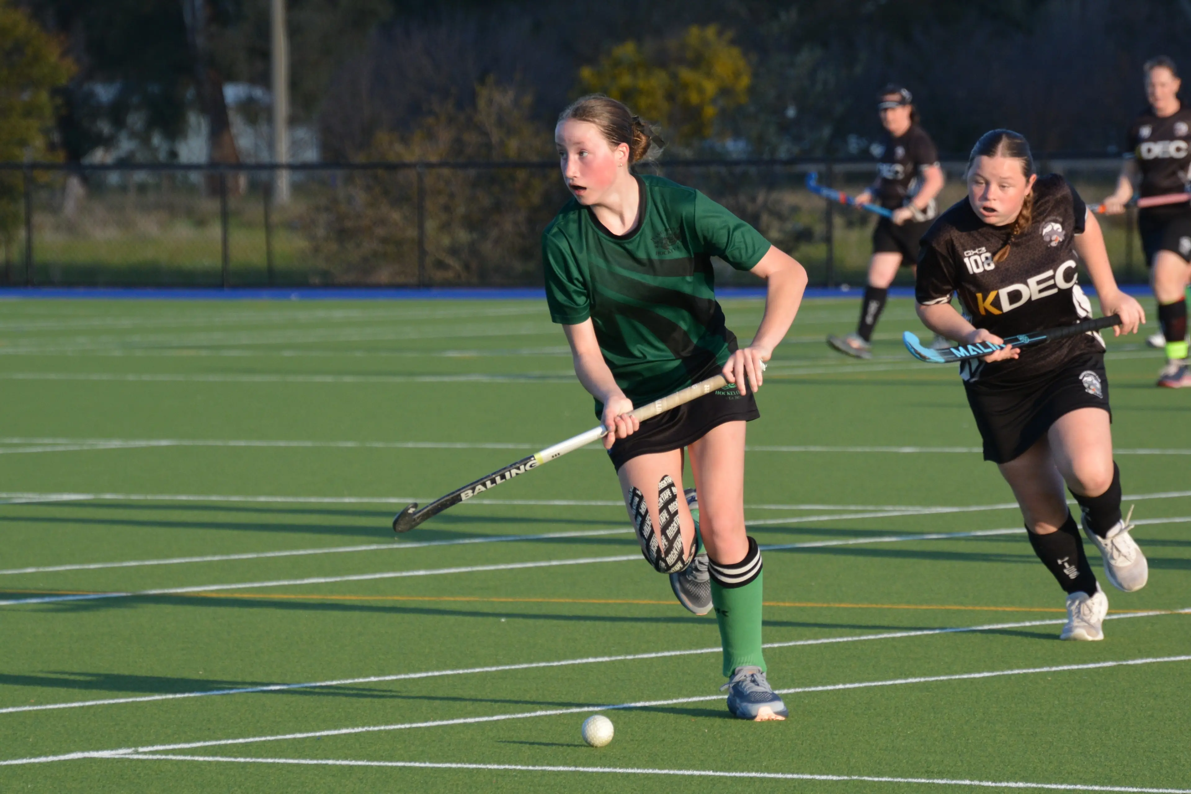 <p>GOLDEN HOUR: Elsie Cunneen runs the ball up the field in the setting sun. PHOTO: Kylie Samson</p>\\n