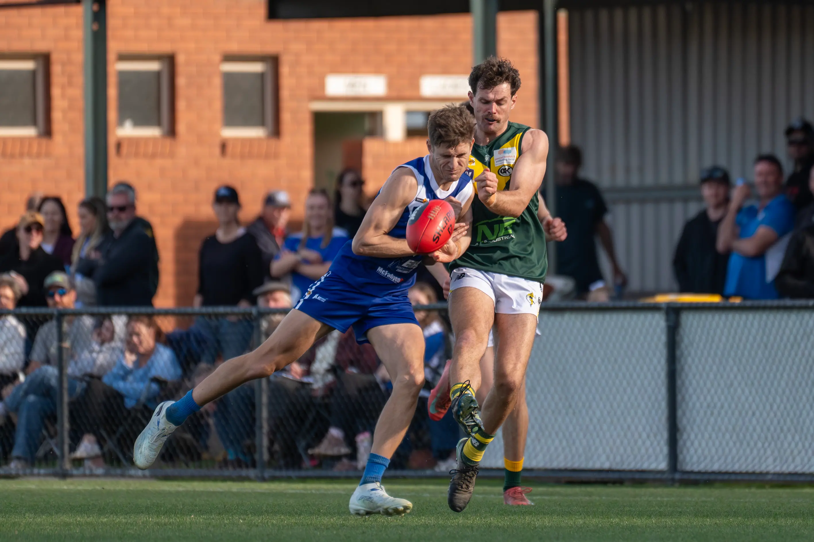 <p>GOOD BUMP: Moyhu\\'s Bailey Zimmermann is bumped as he kicks by Bright\\'s Daniel McCormick. PHOTO: Melissa Beattie</p>\\n