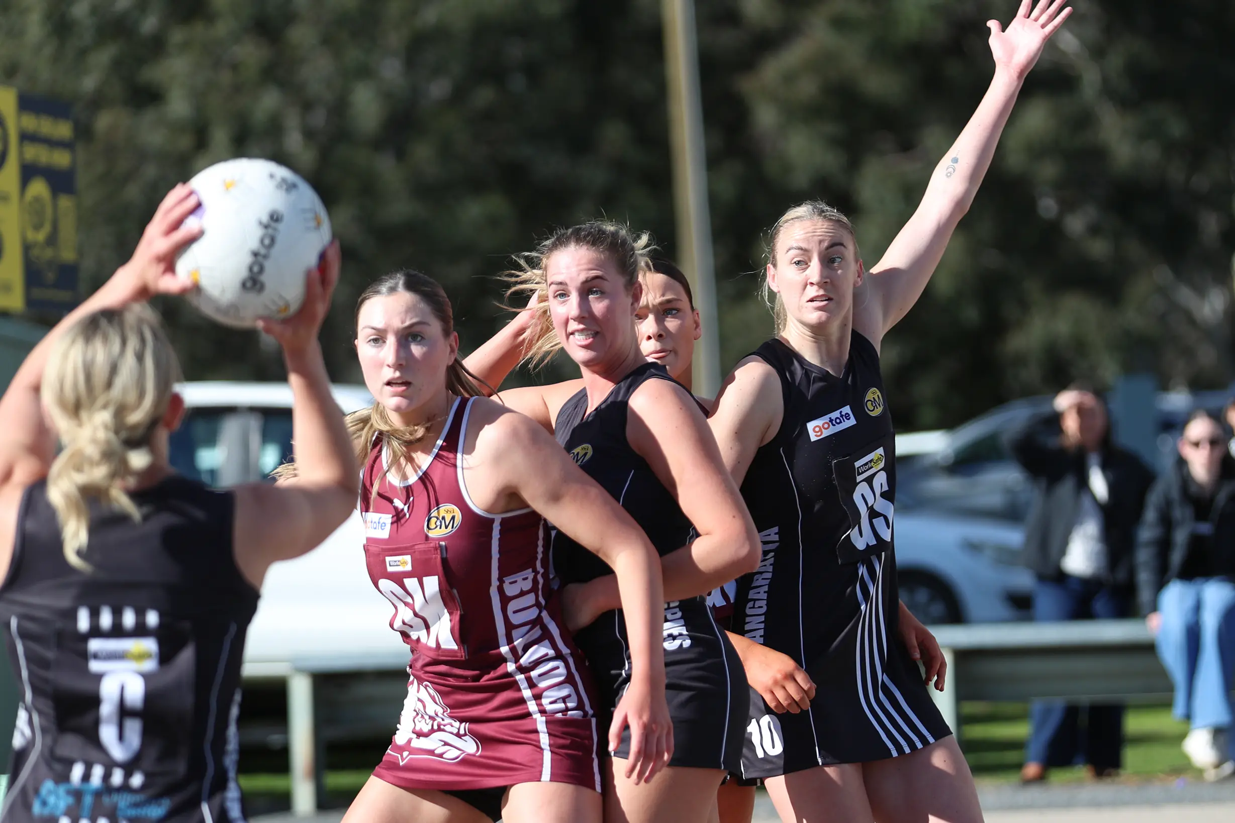 <p>OVER THE TOP: Wangaratta\\'s Leah Jenvey (c) prepares to loop the ball over Georgia Clark and the Wodonga defenders to goal-scoring machine Amanda Umanski. PHOTO: Melissa beattie</p>\\n