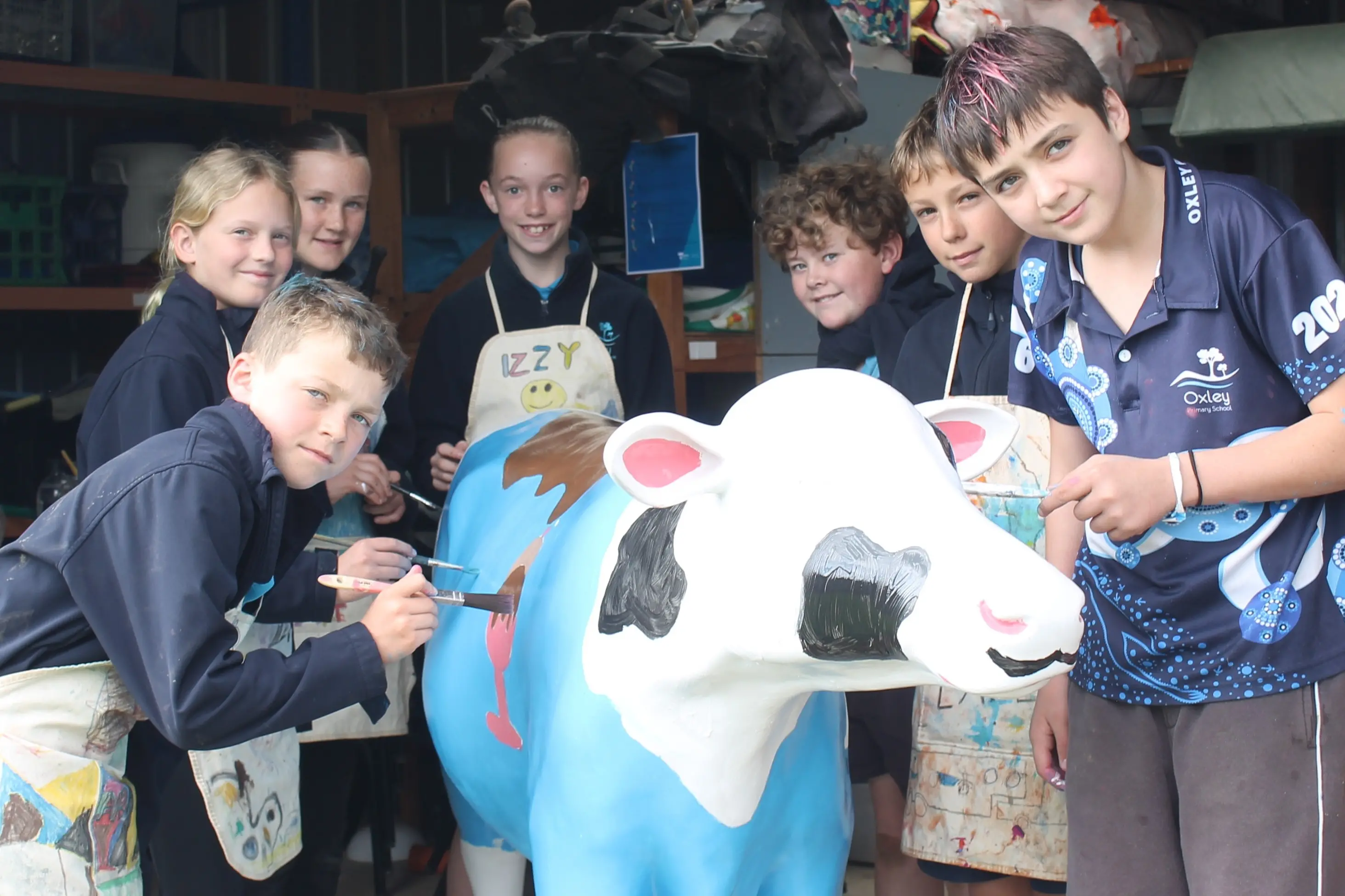 <p>UDDERLY OUSTANDING: Oxley Primary School grade 5/6 students Riley Bennett, Marie Jones, Bella Zabilowiz, Harriet Blum, Nathan Shaw, Harper Waters and Alex Bryne are excited to be entering the final stages of designing and producing their life-sized cow as part of Dairy Australia\\'s Picasso Cows program. PHOTO: Grace Fredsberg</p>\\n