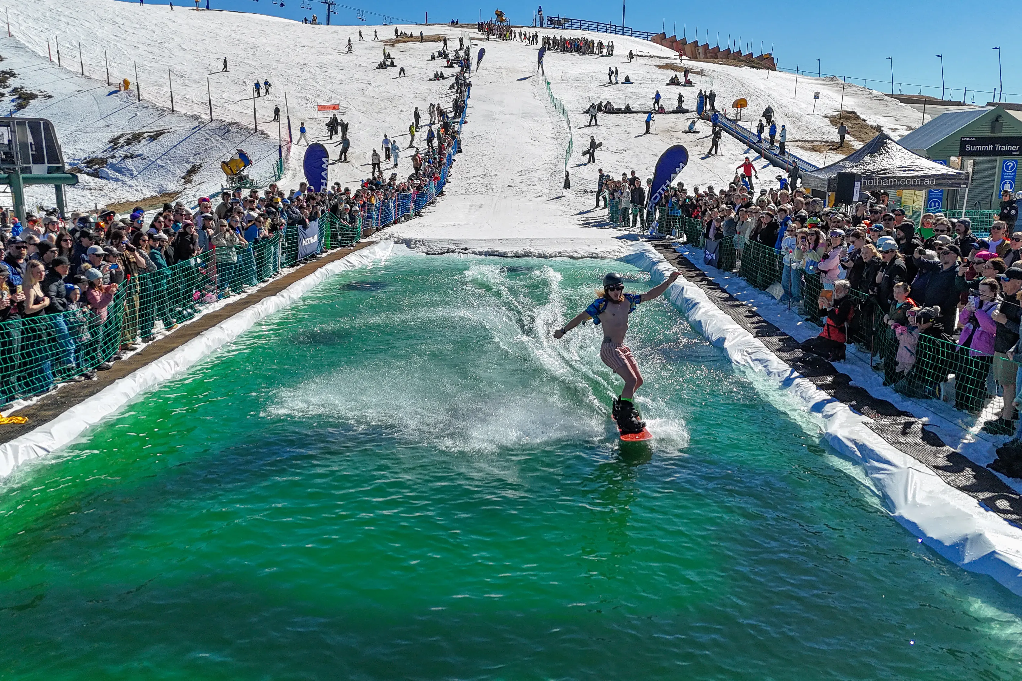 <p>WET AND WILD: Hundreds of spectators cheered on competitors in the second annual Bird Bath Pond Skim event at Mt Hotham on Monday this week. PHOTO: Chris Hocking</p>\\n