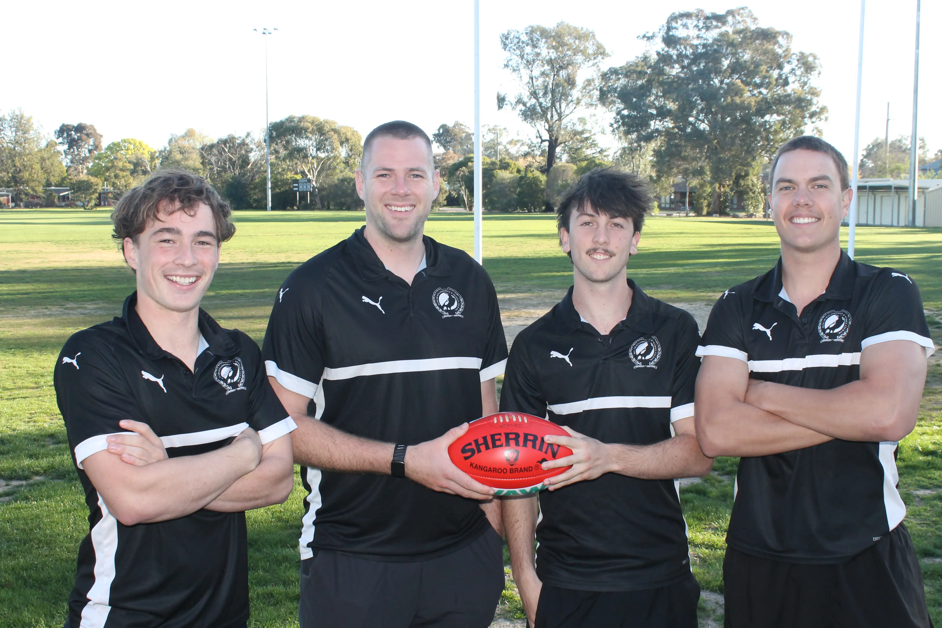 <p>THE MIGHTY BLACK AND WHITE: Magpies thirds footballers (from left) Will Prebble, coach Chris Knowles, captain Callum Bott and Charlie Haring take to the field in their grand final against Wodonga Raiders. PHOTO: Nathan de Vries</p>\\n