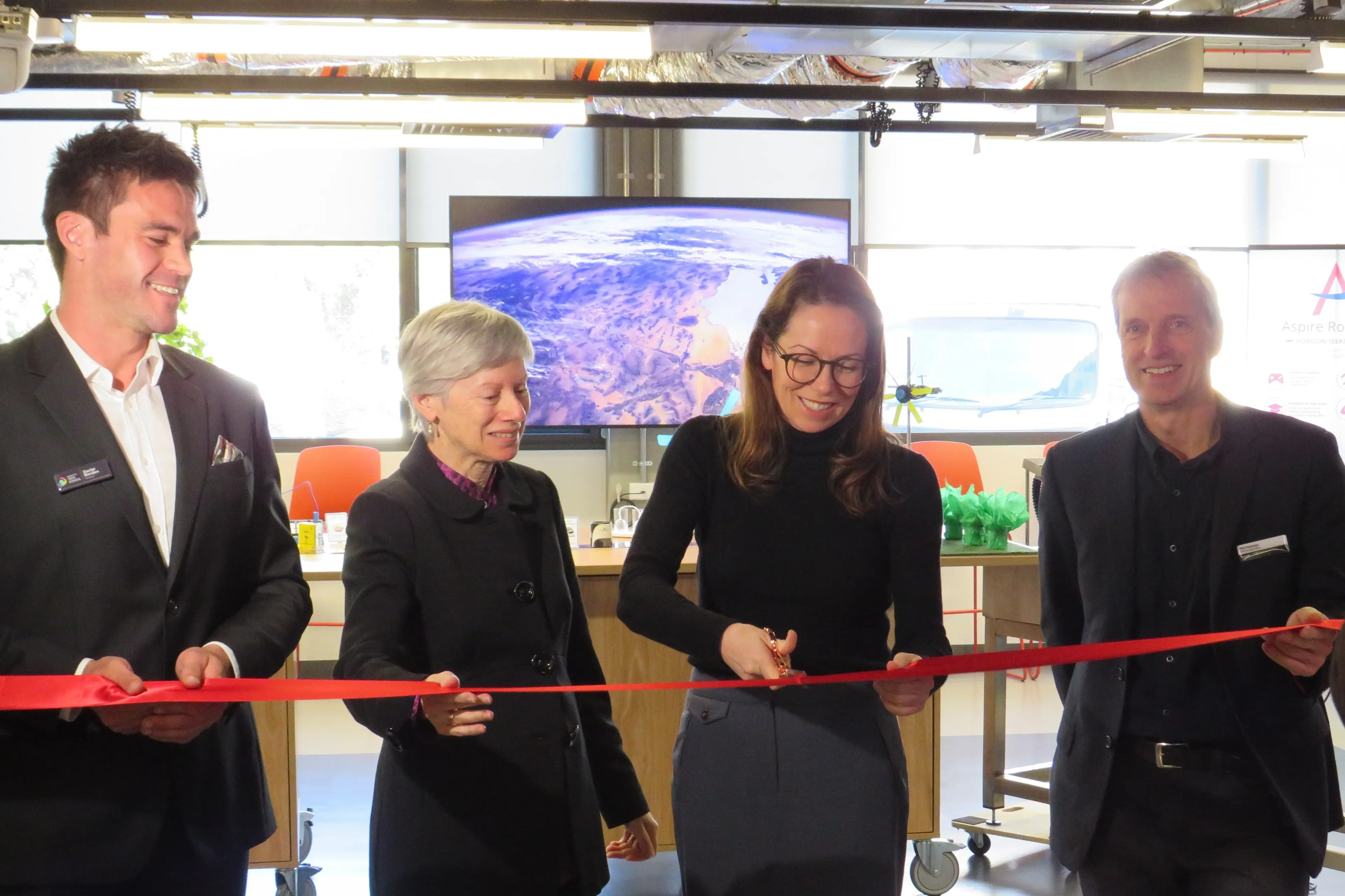 <p>MAKING IT OFFICIAL: Member for Northern Victoria Jaclyn Symes cuts the ribbon to officially open the Wangaratta Tech School on Thursday, as school director Xavier Norden, Northern Victoria Institute of TAFE (NVITAFE) board chair Candy Broad, and NVITAFE chief executive officer Phil Paterson look on.  PHOTO: Simone Kerwin</p>\\n