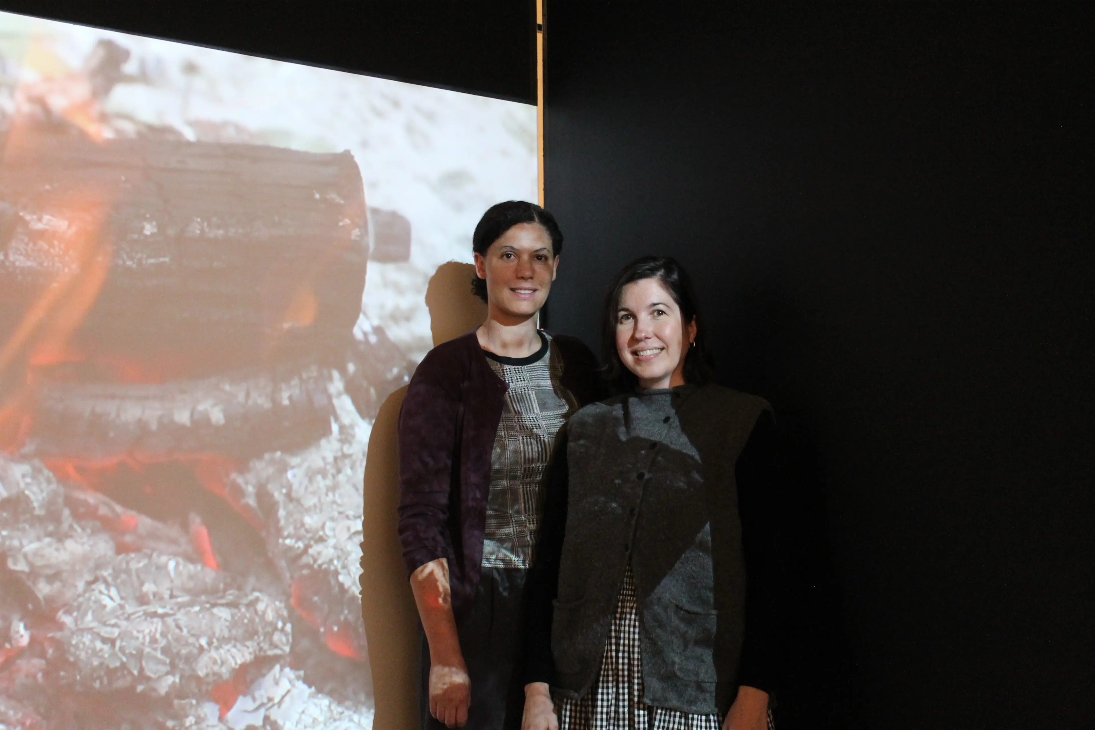<p>TANNIN TALES: \\'Tannic Bonds\\' curators Olivia Welch and Meg Fizell with one of the works featured in this exhibition, Moorina Bonini\\'s film Bitja (Fire), 2020. View this work and more from this exhibition at the Wangaratta Art Gallery until Sunday, 29 November. PHOTO: Grace Fredsberg</p>\\n