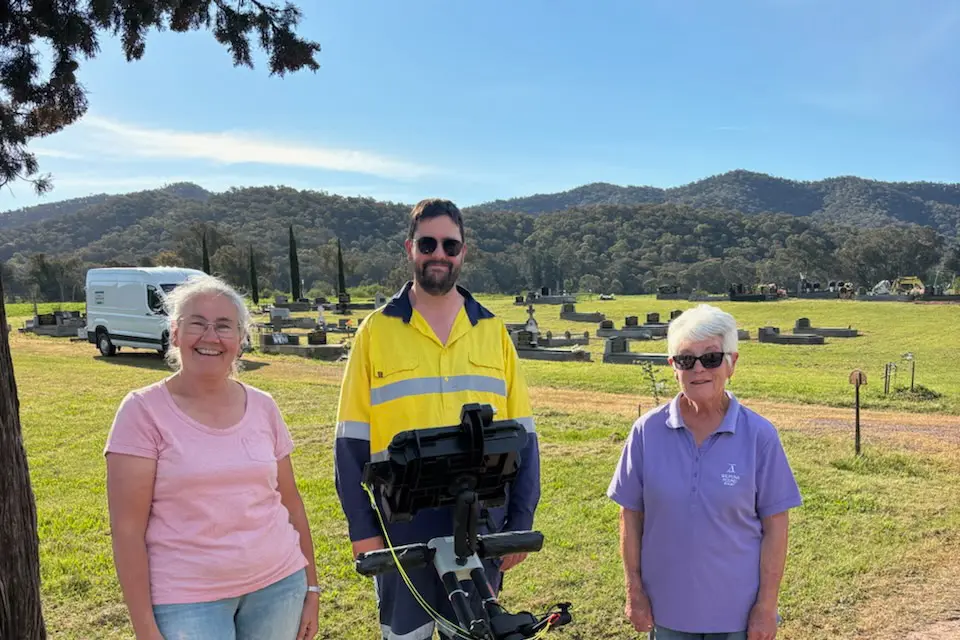 <p>THE CEMETERY SEARCH CONTINUES: Whitefield Cemetery Trust members Jean Box and Lloydie Batten with David Hunter as he surveys the ground below.</p>\\n