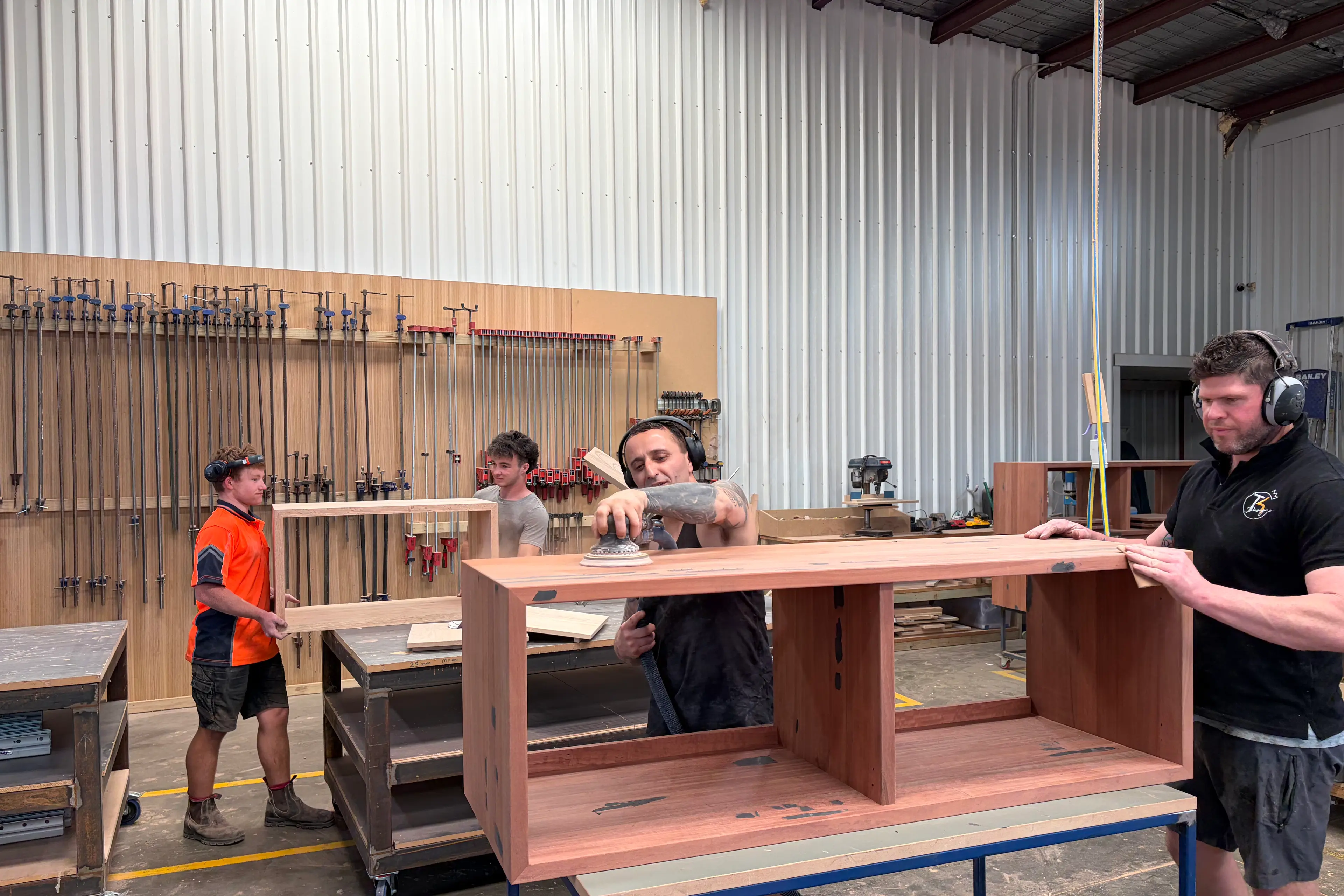 <p>MORE THAN JUST A BATHROOM VAINITY: Thomas Kyriakou (centre with hand polisher) and leading hand Isaac Goldsmith with Murray Ellis and Pat Ford in the rear</p>\\n